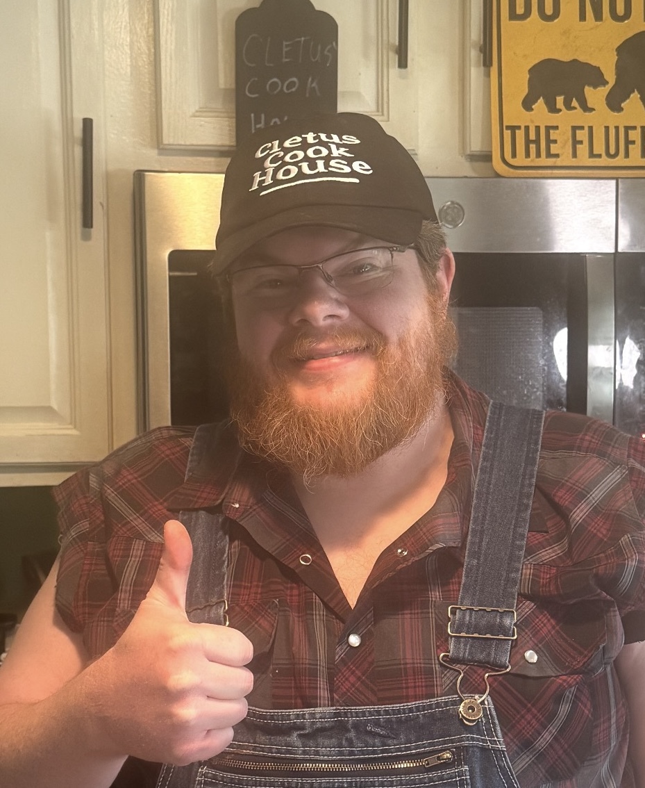 Cletus Boone smiling in the kitchen